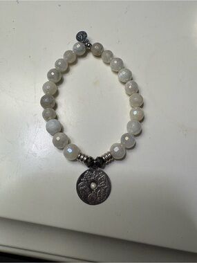 Faceted Cream Bead Bracelet with Decorative Silver Medallion